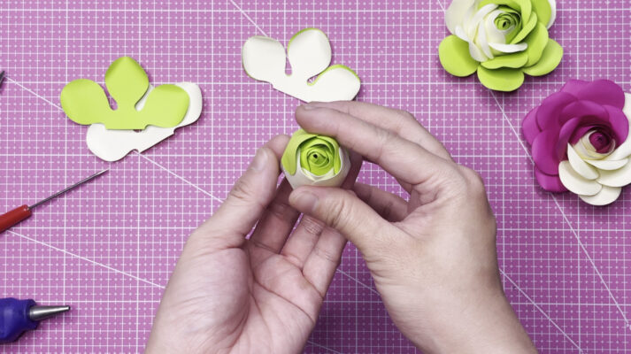 Repeat the same process of pasting petals together for the second layer, ensuring the petals are closed tightly